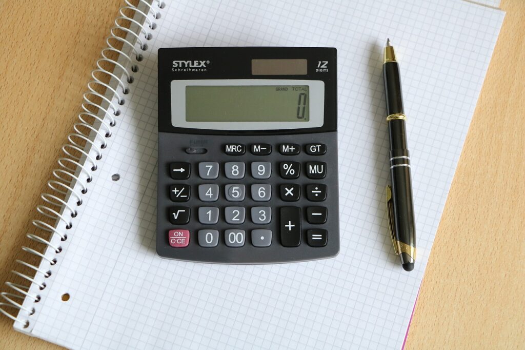 Calculator and pen. Replace these with a purpose build Excel calculator.